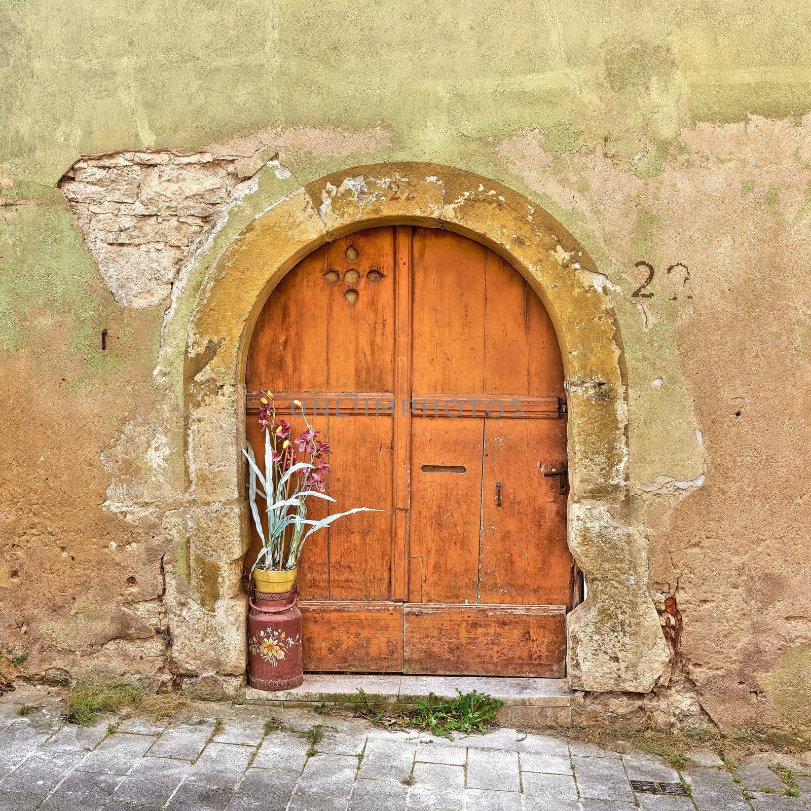 Old entrance door of a historic medieval house in the old town of Rothenburg ob der Tauber in Bavaria, Germany