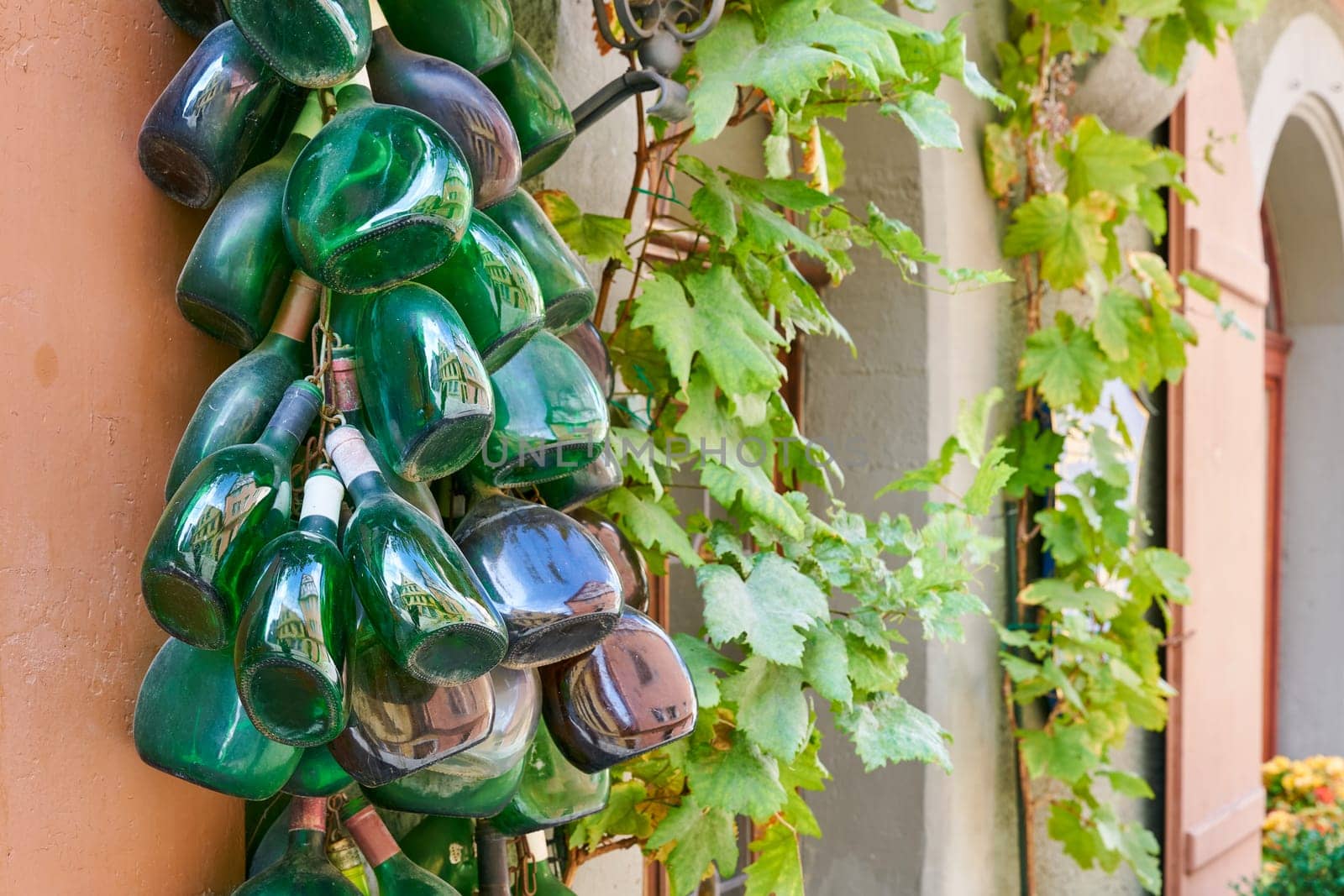 Wine bottles, so-called traditional Bocksbeutel, as decoration on a facade in Rothenburg ob der Tauber in Franconia in Germany