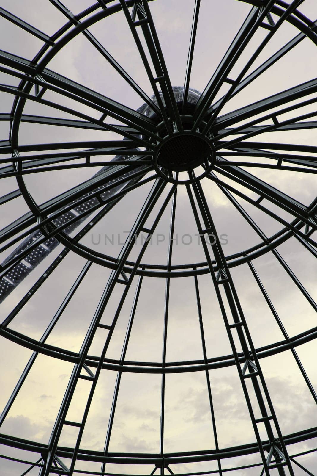 Glass rotunda and cloudy sky in the background
