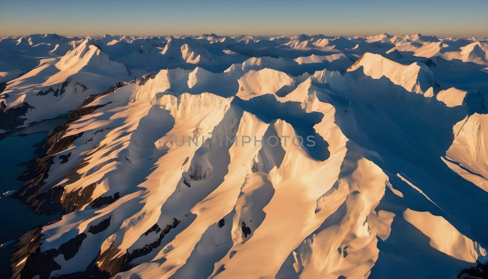 Golden Glimpse: Antarctic Peaks in Warm Light and Blue Shadows