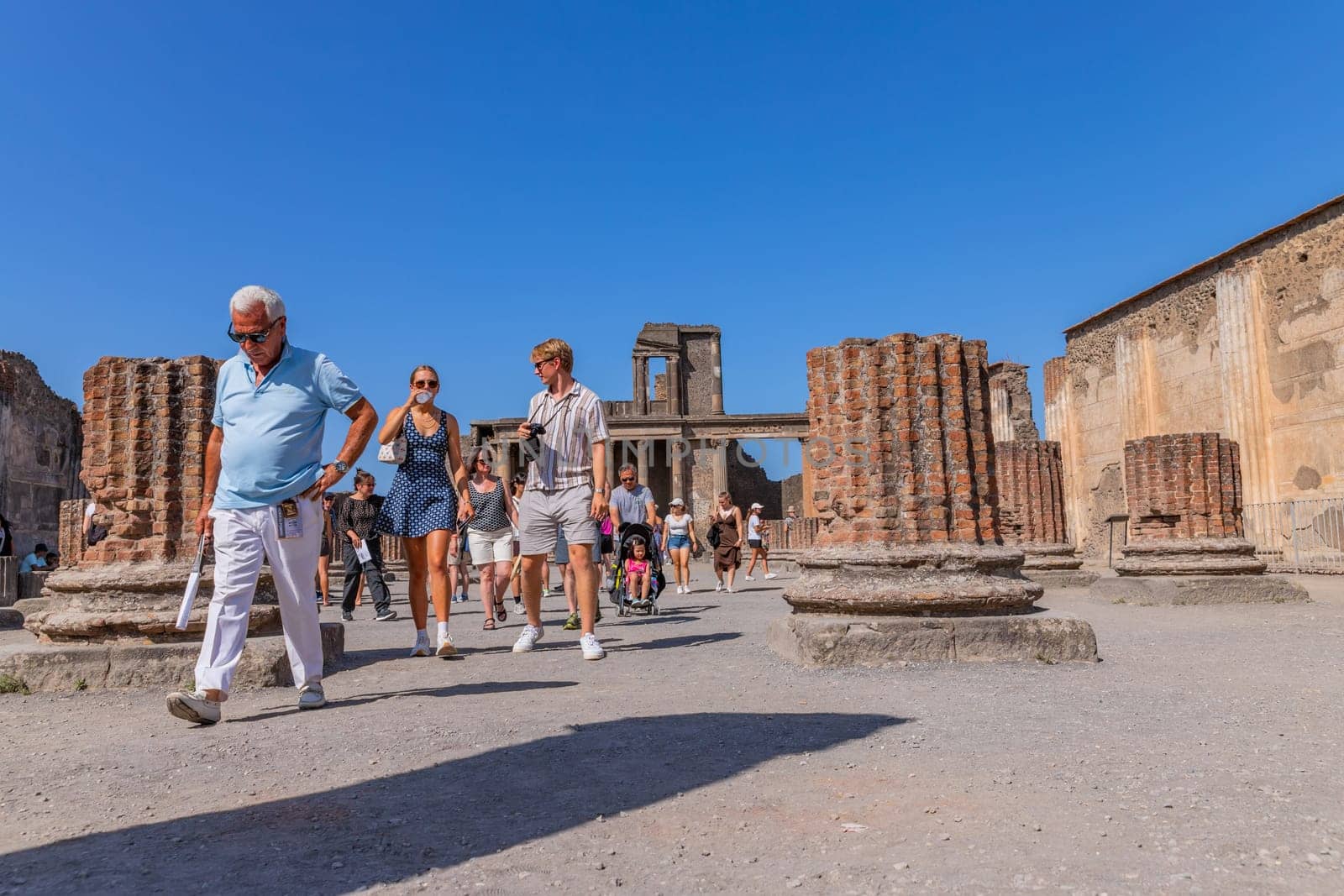 Pompeii, Italy - August 8, 2024: Ruins of a city. Pompeii is an ancient Roman city died from the eruption of Mount Vesuvius in 79 AD.
