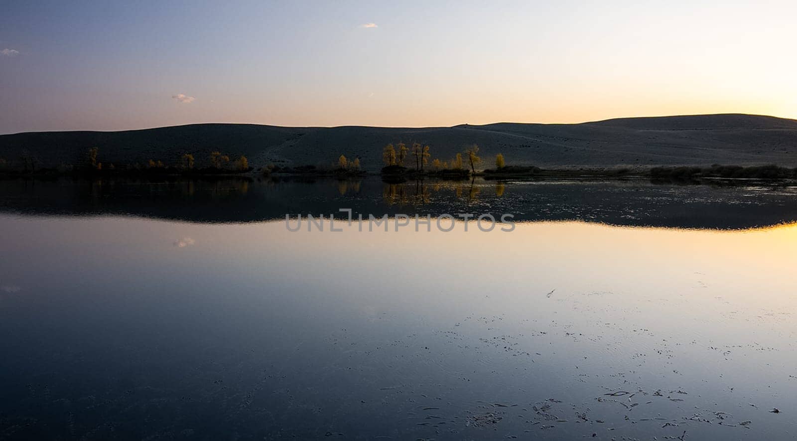 Lake in the Altai Mountains. Panorama of the Altai landscape in the mountains. The time of year is autumn.