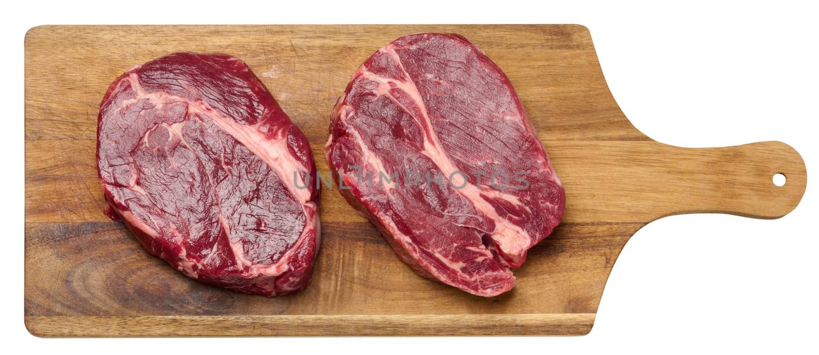 Raw beef steak chuck eye roll on wooden board, top view