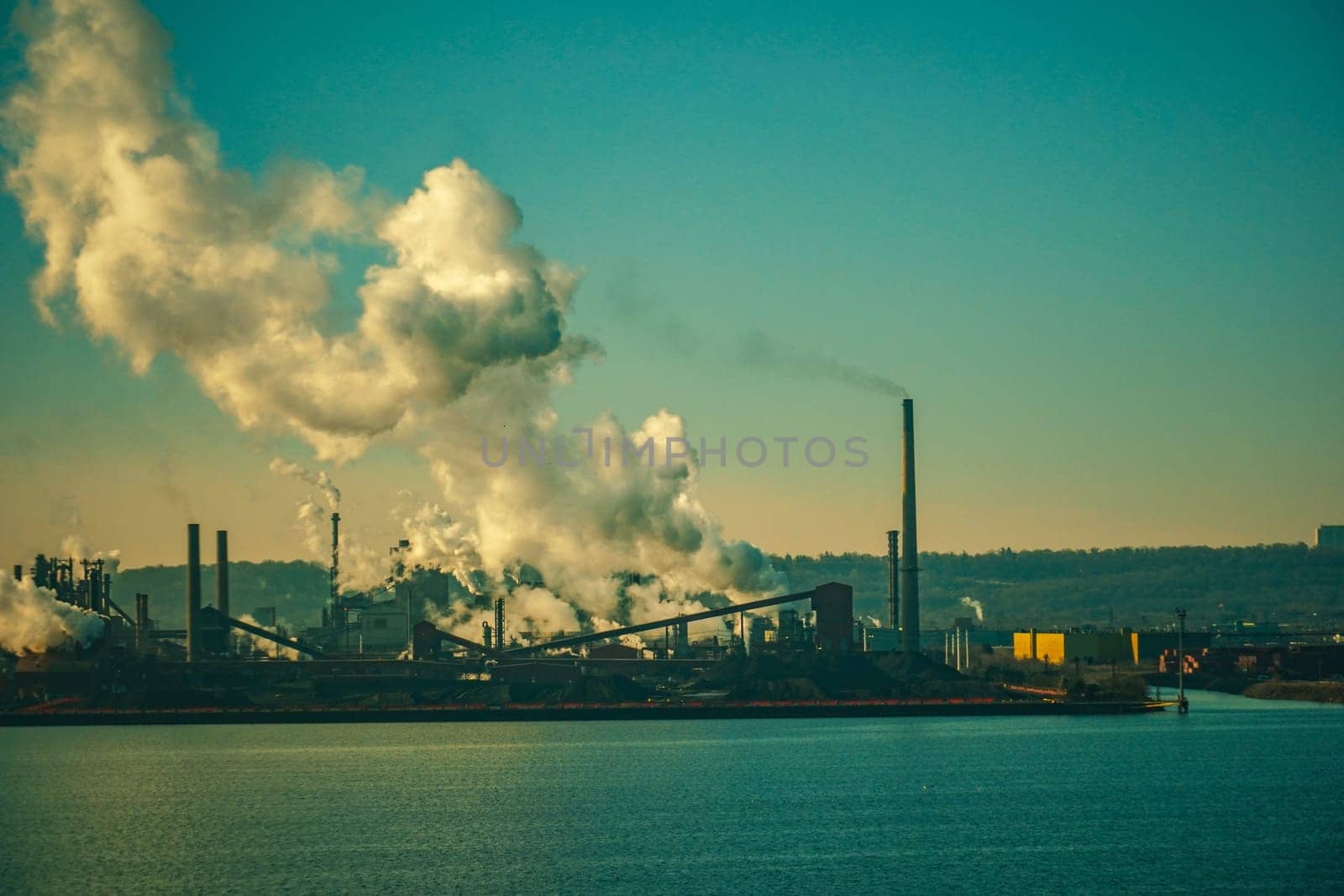 Evening view of the industrial city by the water. Shooting Location: Toronto