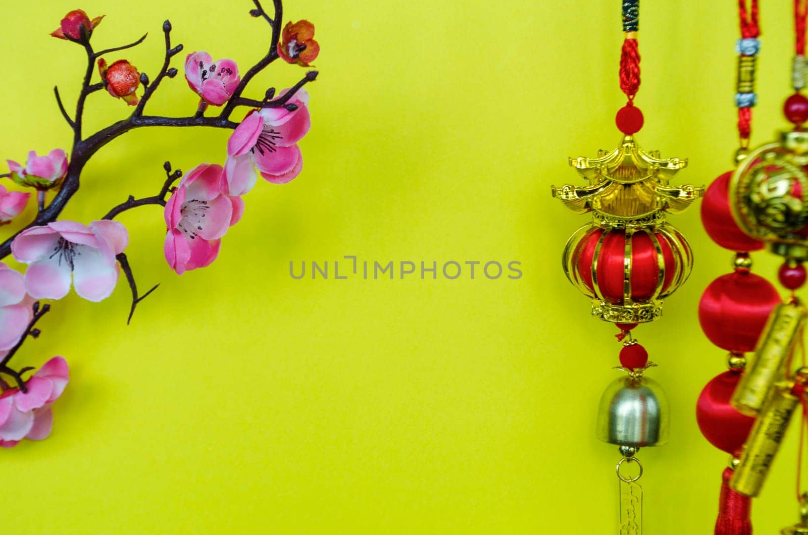 Chinese New Year decoration with on yellow cover background with customizable space for text. Chinese New Year celebration concept.