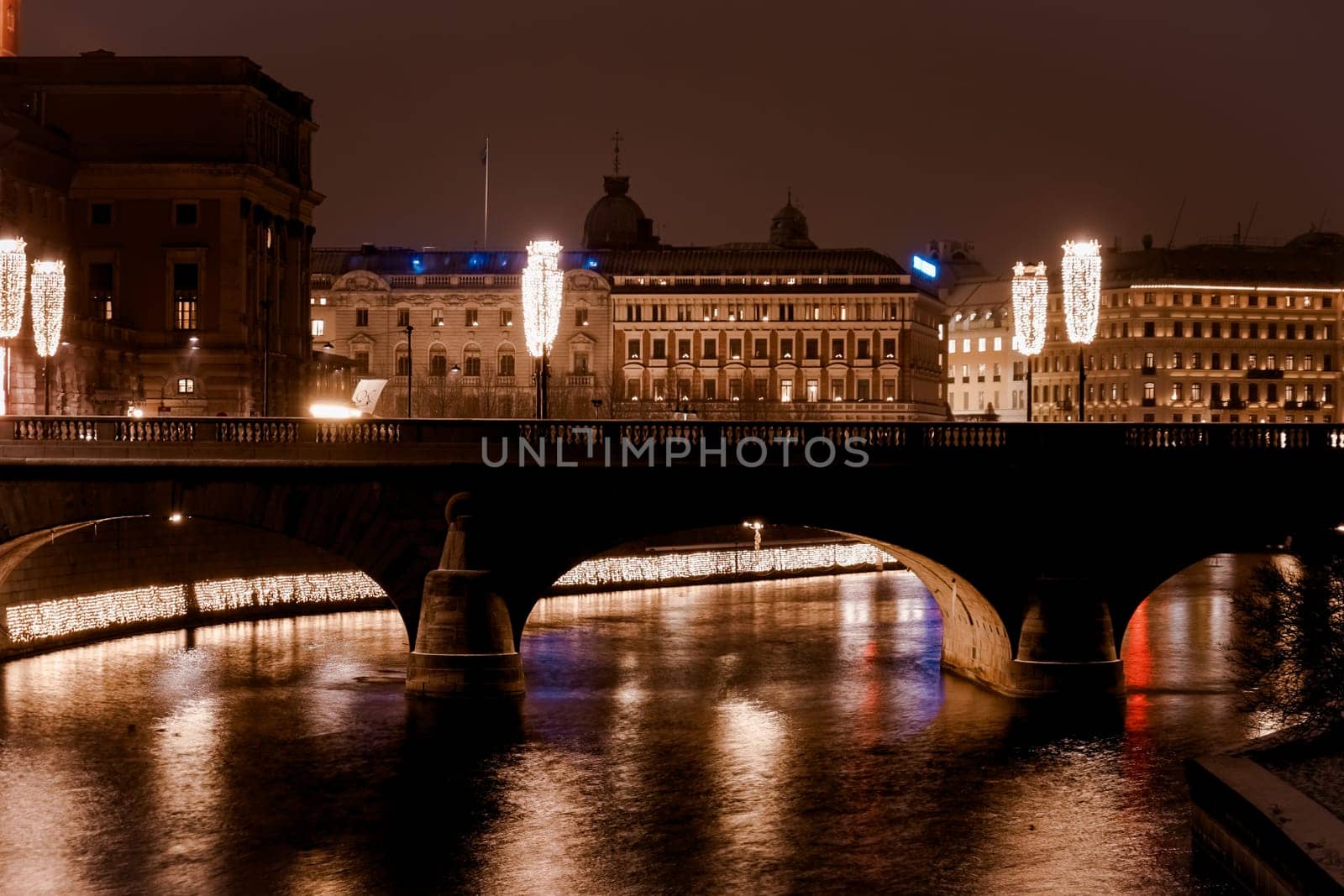 Bridge and illuminated buildings at night. Shooting Location: sweden, stockholm