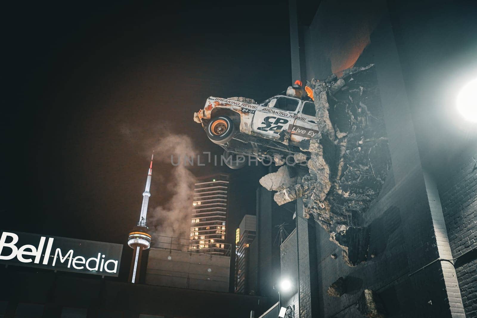 Art of a car crashing through a wall. Shooting Location: Toronto