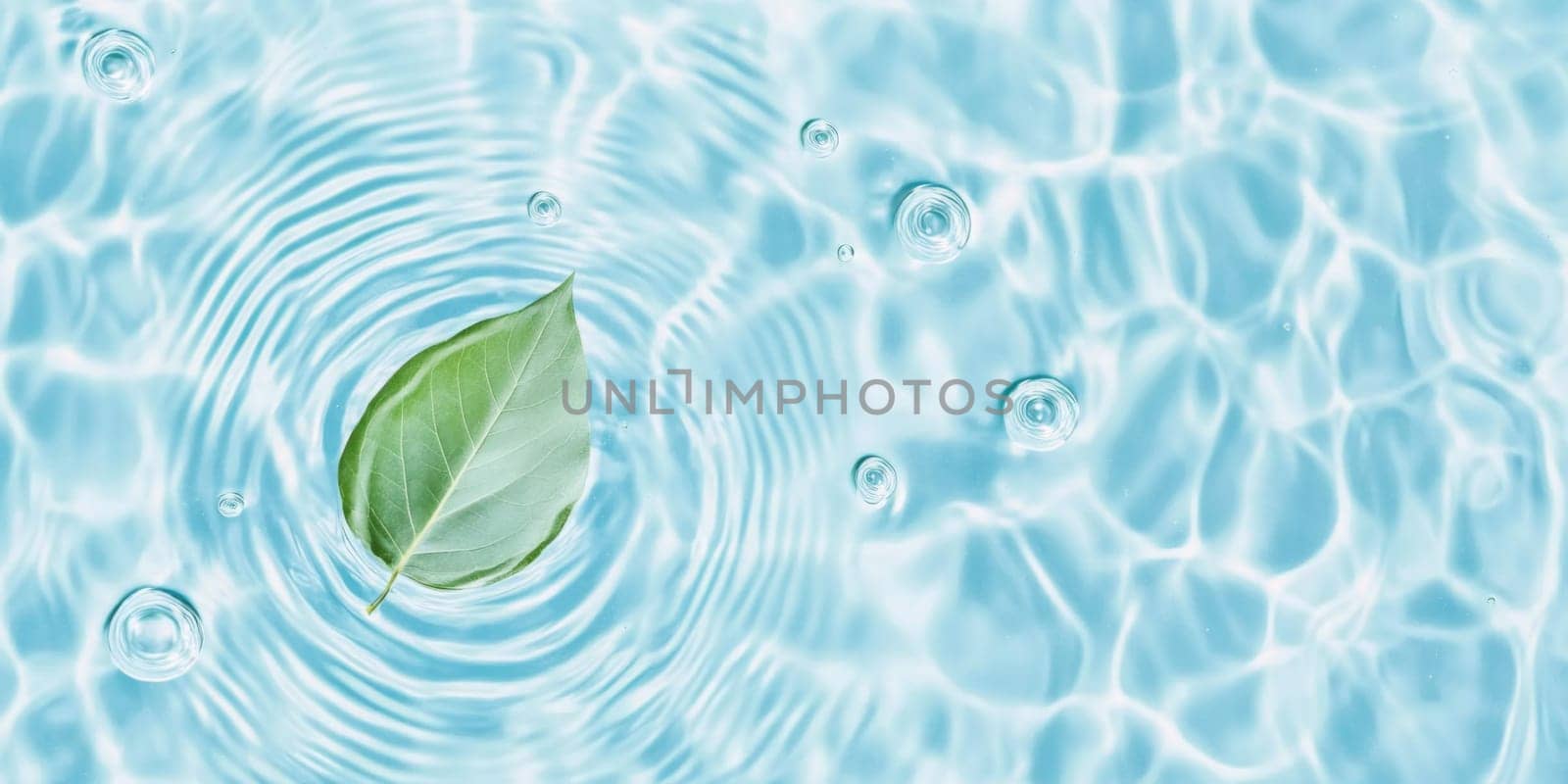 A green leaf floating on water showing ripples and bubbles, suitable as SPA background, AI generated