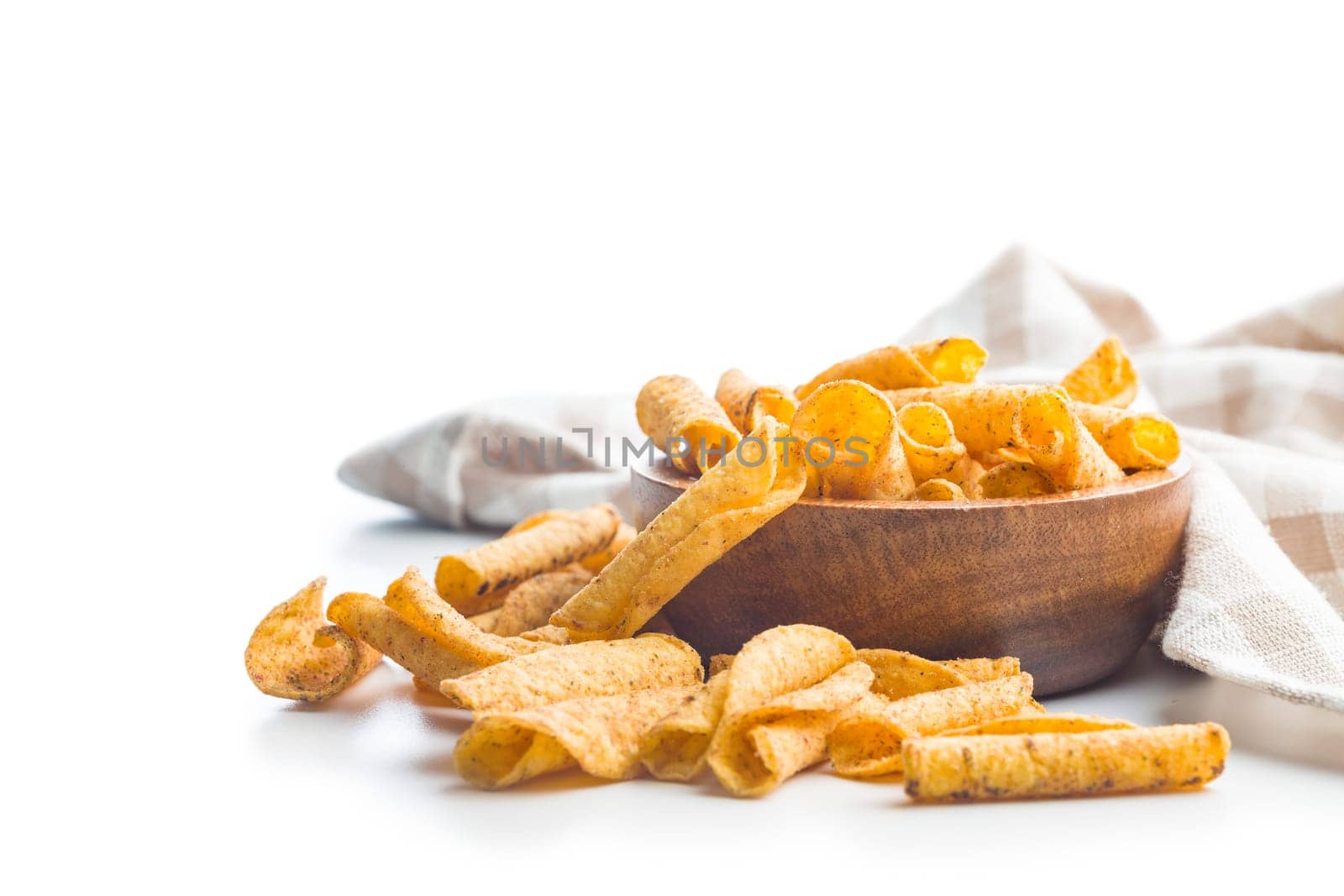 Rolled nachos tortilla chips isolated on a white background.