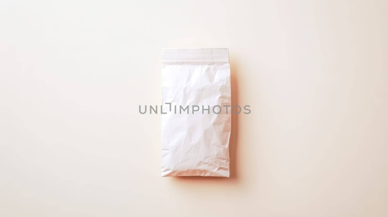 Crumpled white paper bag lying on a cream colored background, creating a minimalist and visually appealing scene, perfect for showcasing product packaging or branding designs