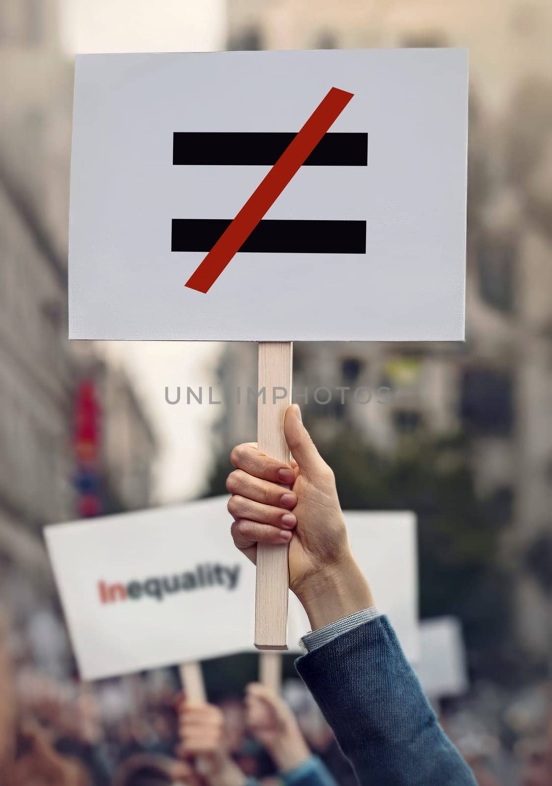 Hands hold banners during protest to stop human inequality as global social issue. Protesters with placards against discrimination on grounds of race, sex or religion. Injustice unfairness symbol