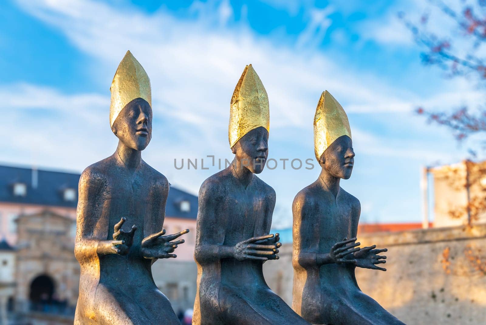 ERFURT, GERMANY - NOVEMBER 30, 2024: Three bishop sculptures in front of the Citadel of Petersberg, one of the largest and best-preserved town fortresses in Europe. The citadel was built on Petersberg hill, in the north-western part of the old town centre.