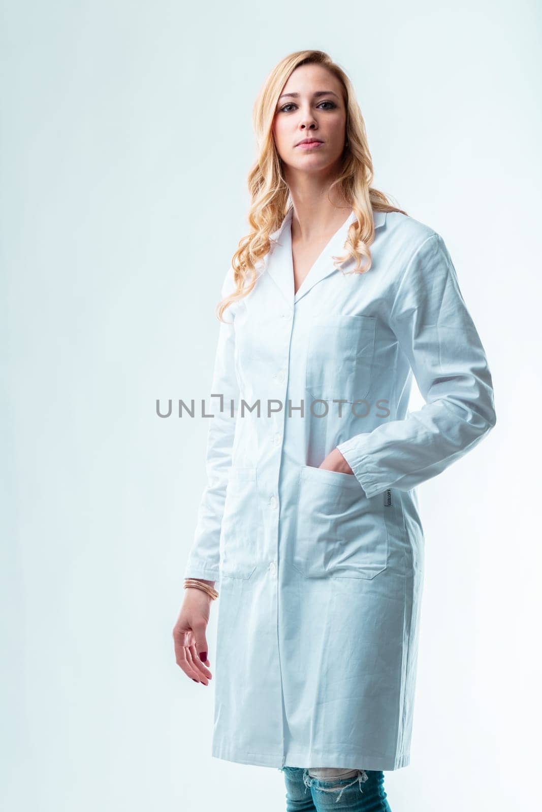 Blonde scientist, capable and driven, wants her knowledge to benefit mankind, but is dubious of ethical shortcomings