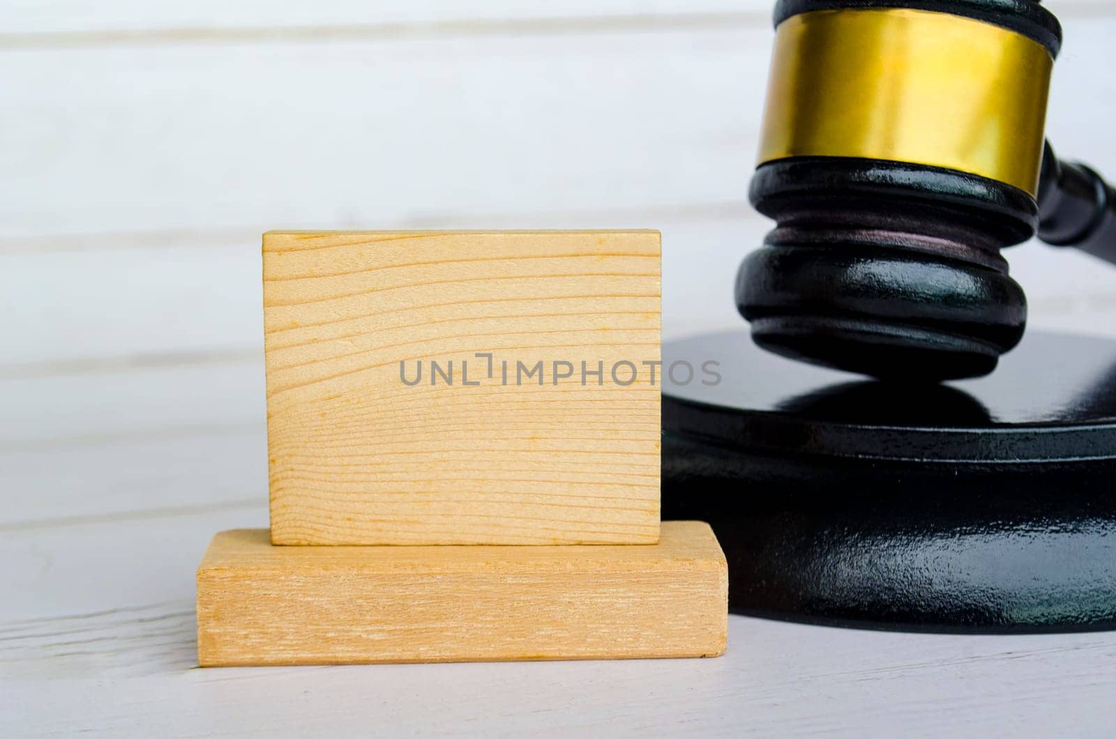 Empty wooden square with customizable space for text with gavel background.