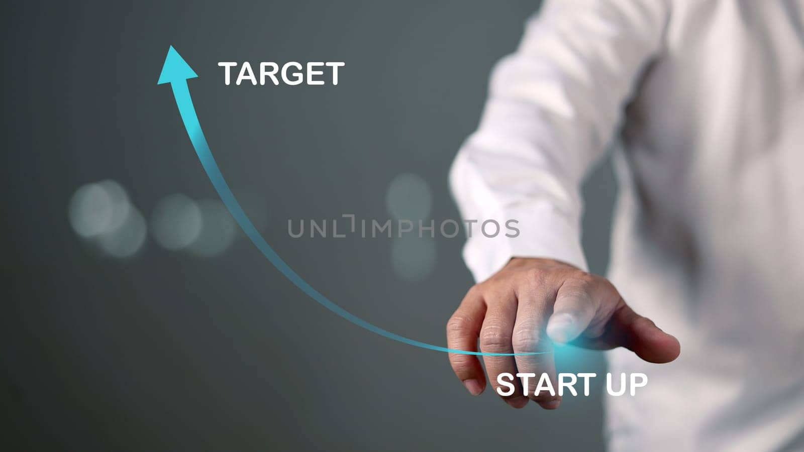 Business startup and goals concept. Businessman is touching the growing business graph, Planning and starting corporate business start up, Arrow icon soars with speed to hit the growth target.
