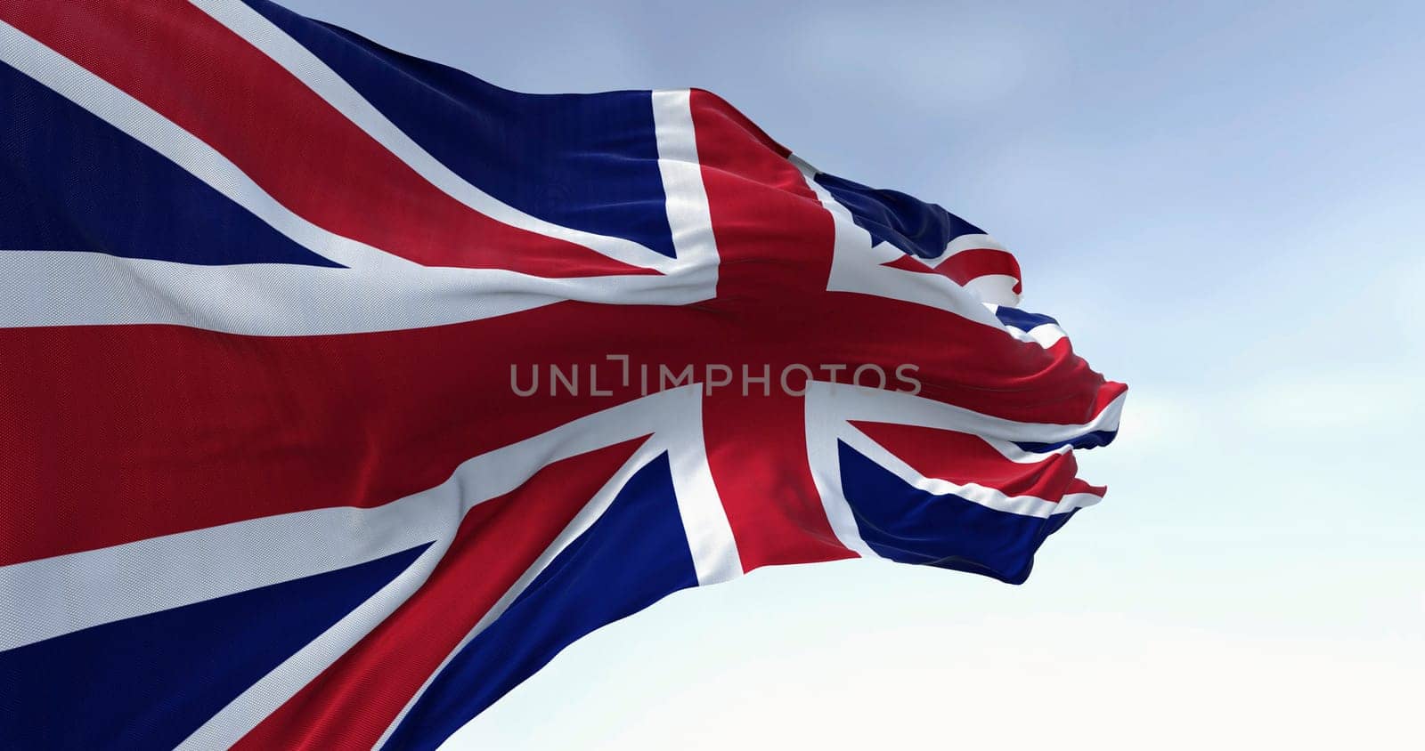 Close-up of national flag of the United Kingdom waving in the wind. Deep blue field with a combination of red and white crosses. 3d illustration render.