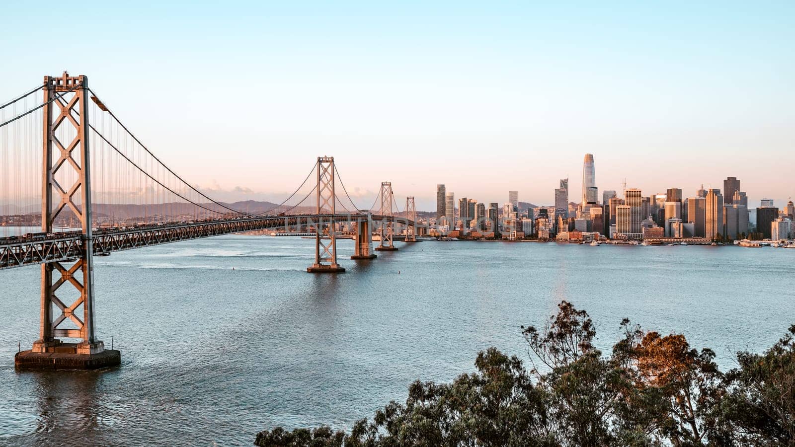 The oakland bay bridge and skyline of san francisco in the morning light