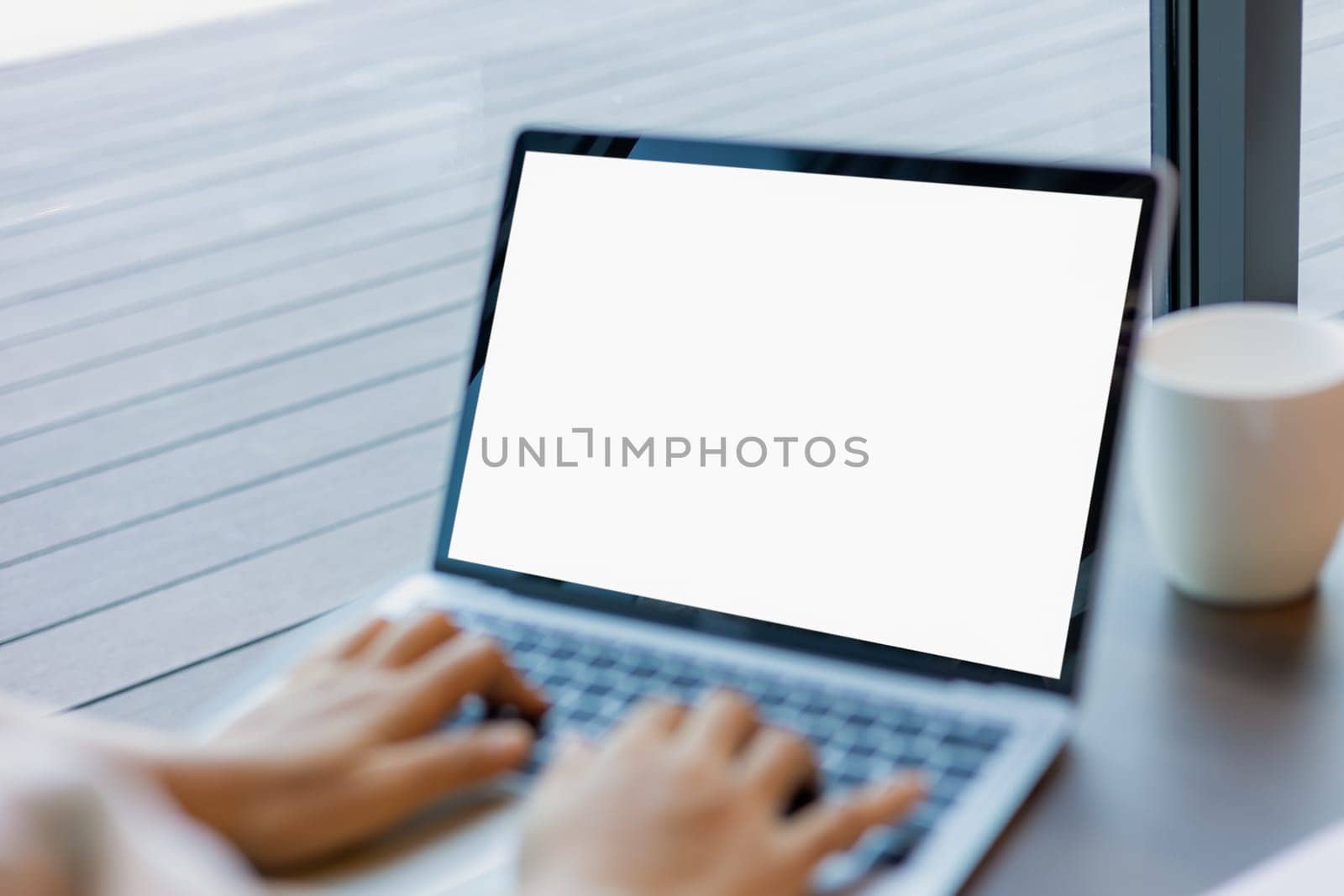 Human hand use laptop and looking at it, Blank screen tablet with white background for advertising text, Woman using laptop contact business search information, Marketing and creative design.