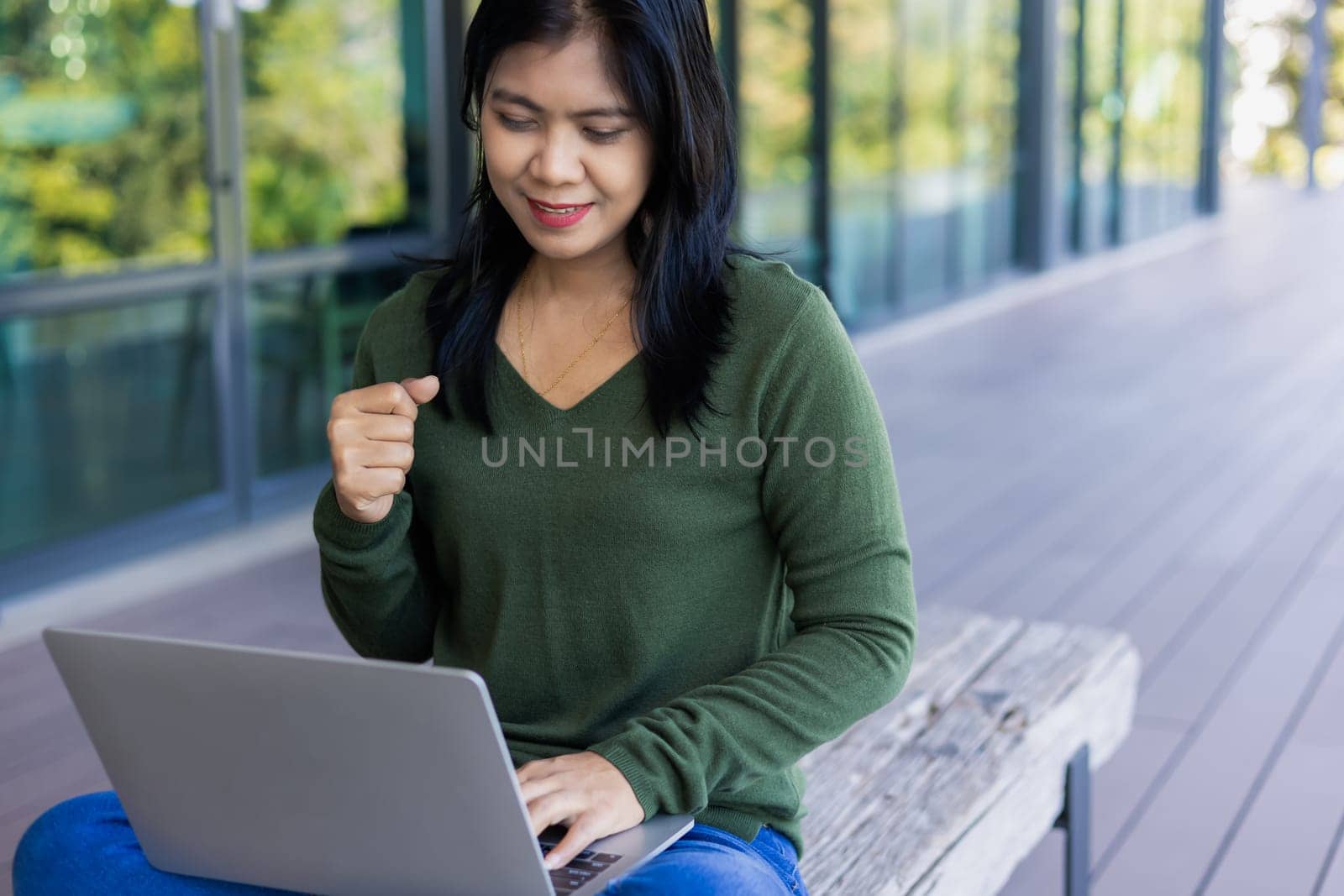 Business woman working from coffee shop using laptop online meeting in home office, Business woman typing keyboard use notebook laptop Smiling, laughing at coffee shop relaxation table.