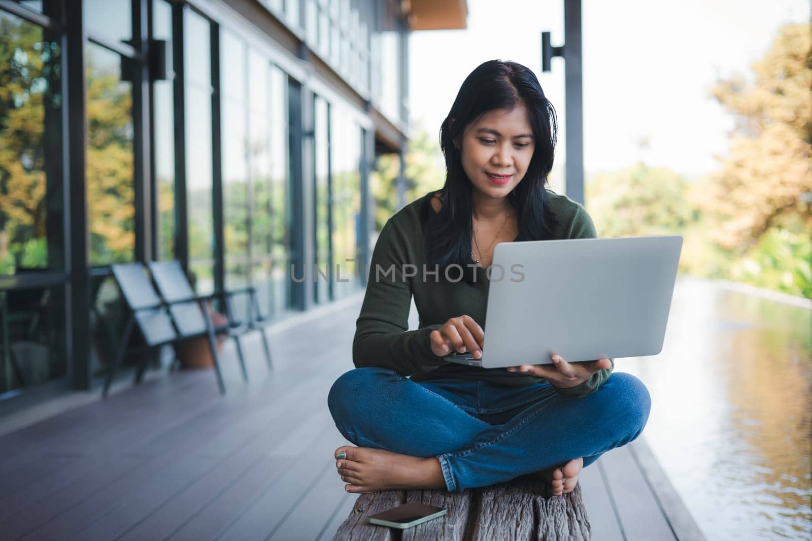 Business concept. Working away from the office. Businessman analyzing company performance graph to generate profit and growth, Businesswoman typing on laptop computer keyboard in coffee shop.