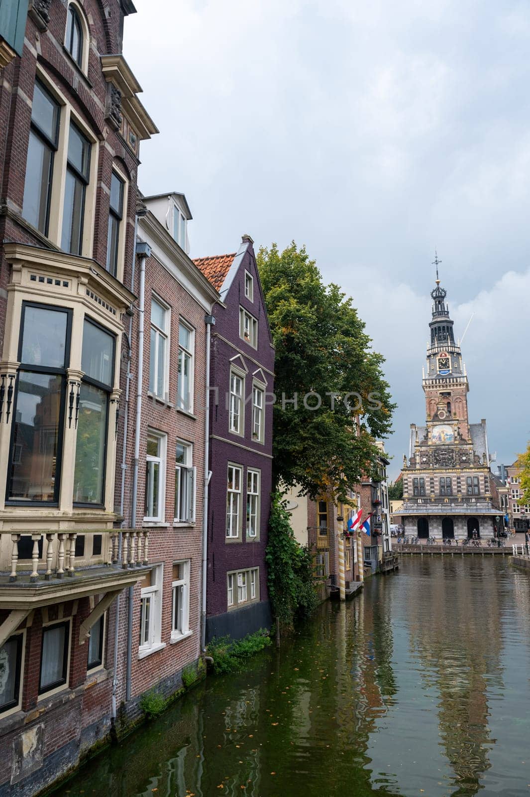 Alkmaar, Netherlands, - View of the city and the weighing house, with the water canal in the foreground