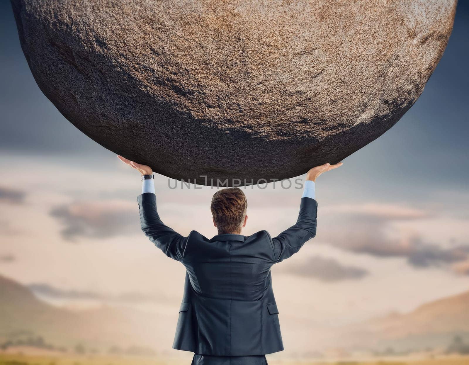 Businessman lifting and holding a big boulder above head. Solving an immense task, symbol of strength and perseverance. Standing up to troubles, burden concept