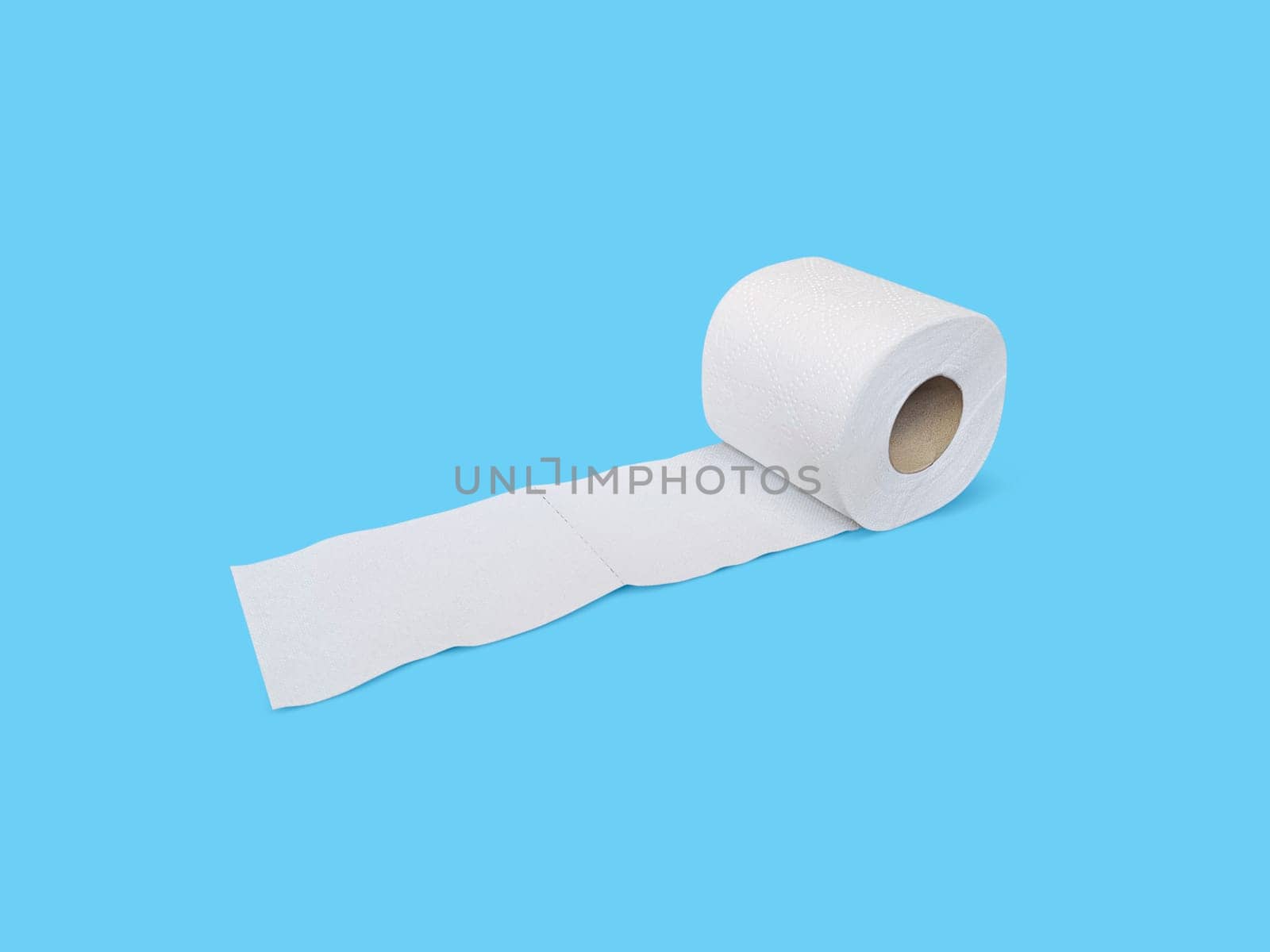 Toilet paper roll on blue background