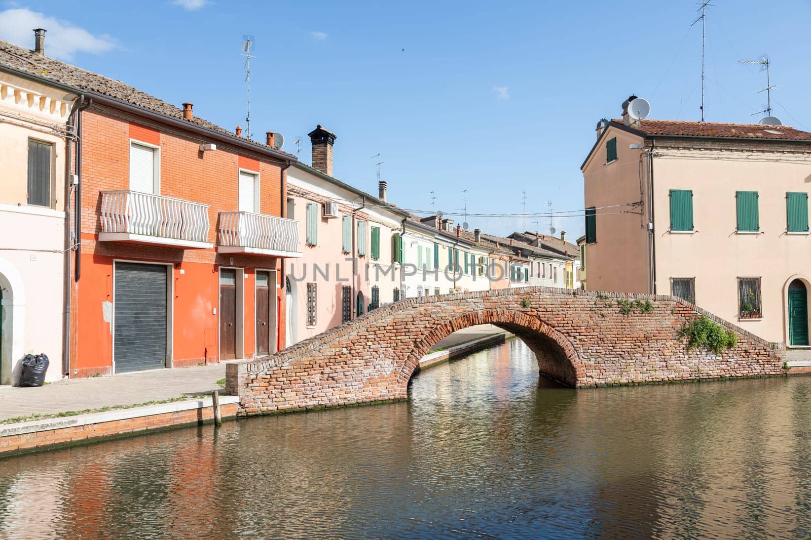 Comacchio, Italy - 11 June 2024. Characteristic village named Little Venice, with bridges and canals.