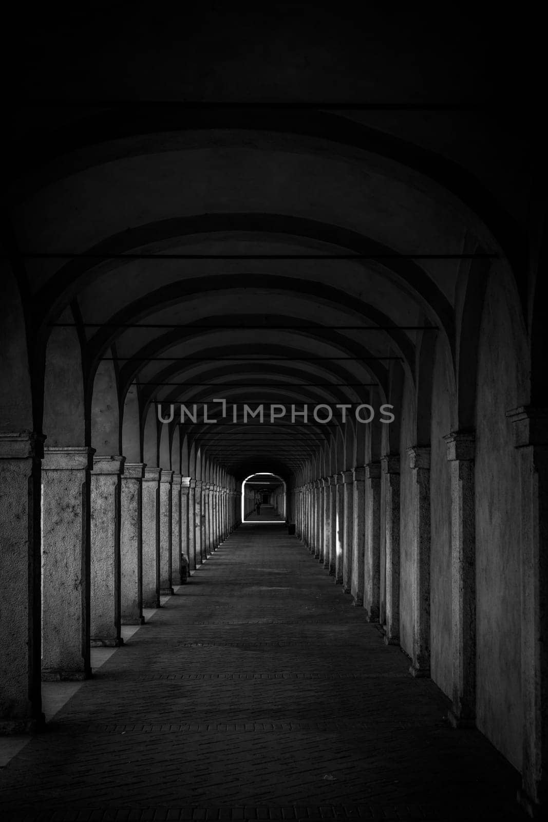 Dark tunnel perspective. Grunge architecture, old corridor in shadow