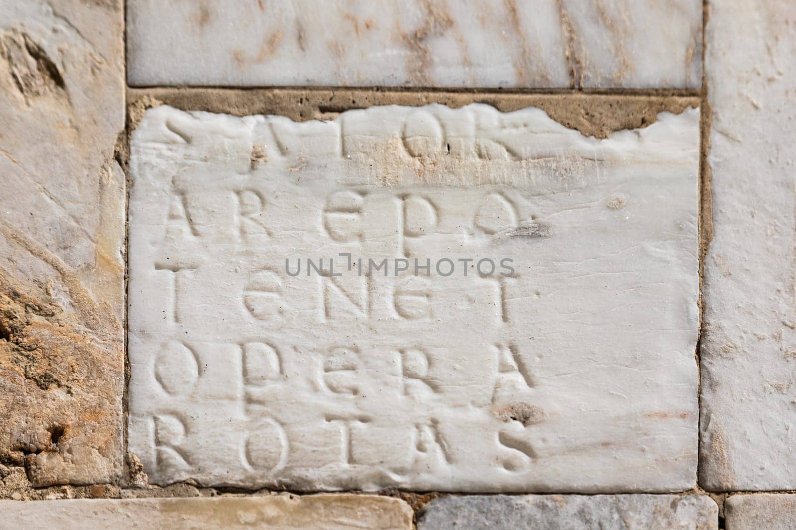 Facade of Siena Cathedral, Italy. The magic Sator square, esoteric word, Latin palindrome, hidden on a marble stone