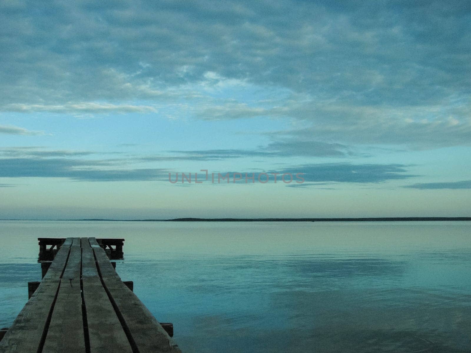A long wooden pier on the shores of Lake Naroch, Belarus.