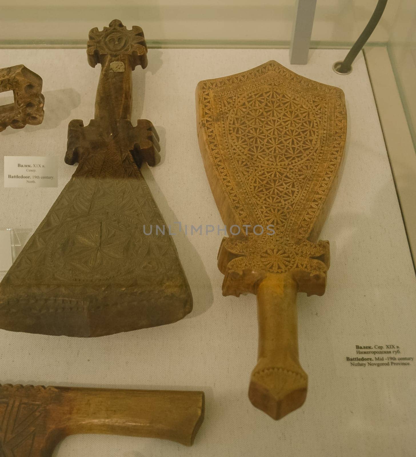 Valek - A flat wooden block with a handle for knocking out linen while rinsing or for rolling it on a rolling pin. Russian culture, museum.