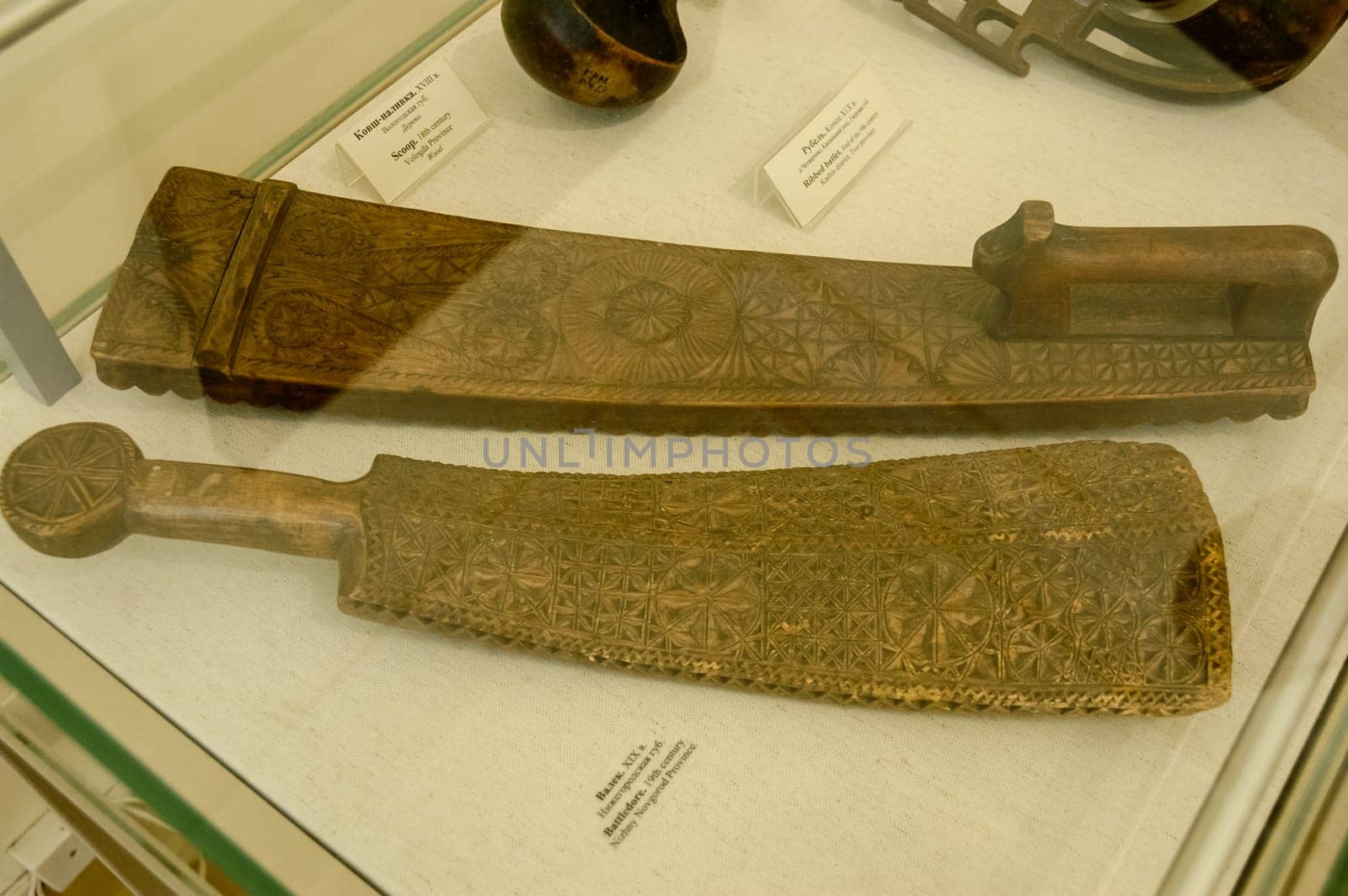 Valek - A flat wooden block with a handle for knocking out linen while rinsing or for rolling it on a rolling pin. Russian culture, museum.