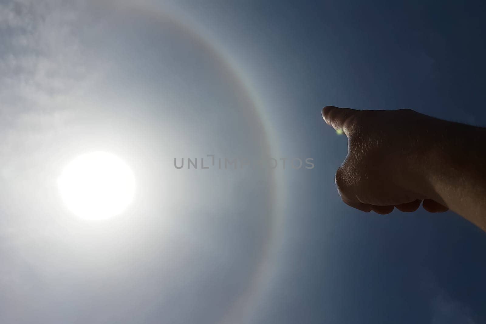The phenomenon of halo in the sky. A rare natural phenomenon. Three halo suns.