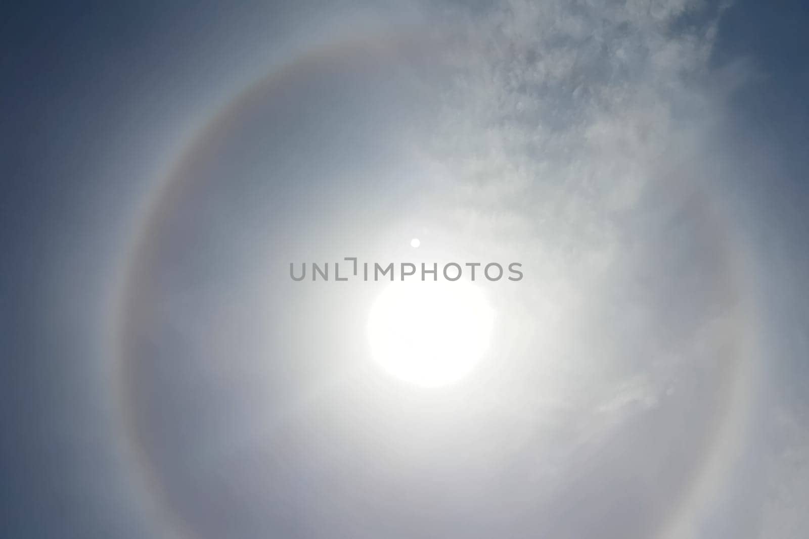 The phenomenon of halo in the sky. A rare natural phenomenon. Three halo suns.