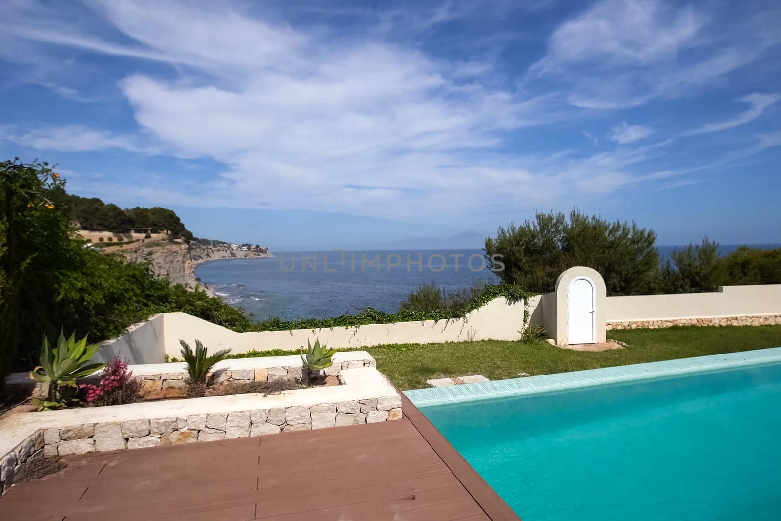 A small house with a swimming pool on the shores of the Mediterranean Sea. Accommodation in Spain.