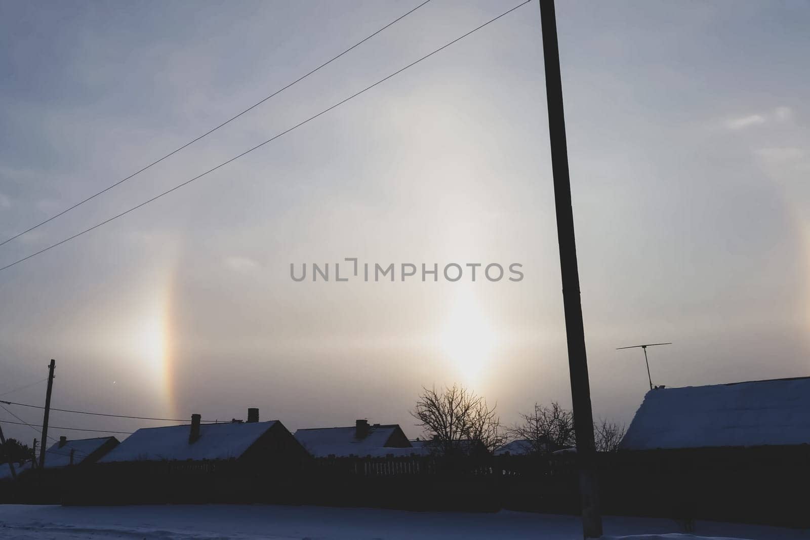 The phenomenon of halo in the sky. A rare natural phenomenon. Three halo suns.
