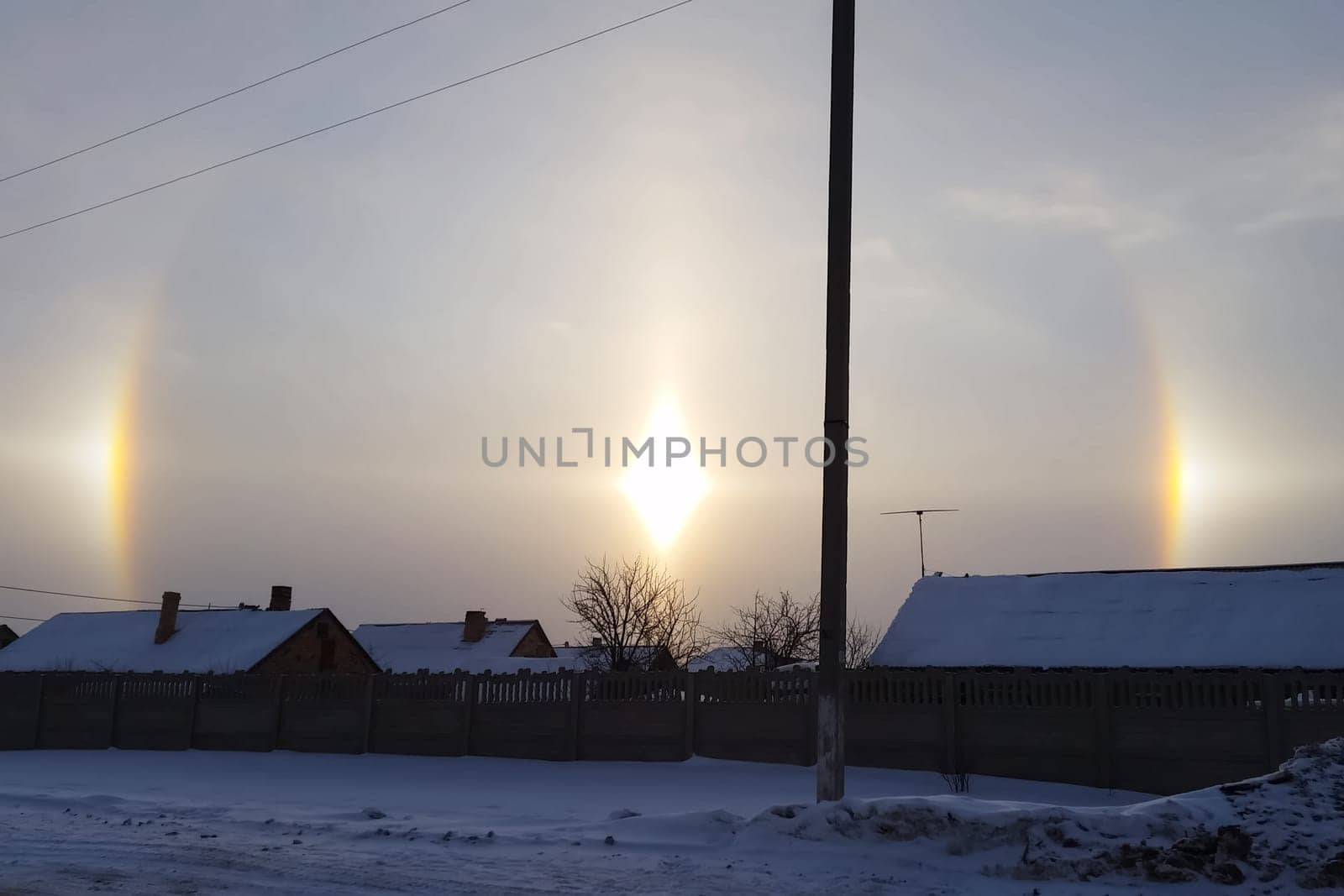 The phenomenon of halo in the sky. A rare natural phenomenon. Three halo suns.