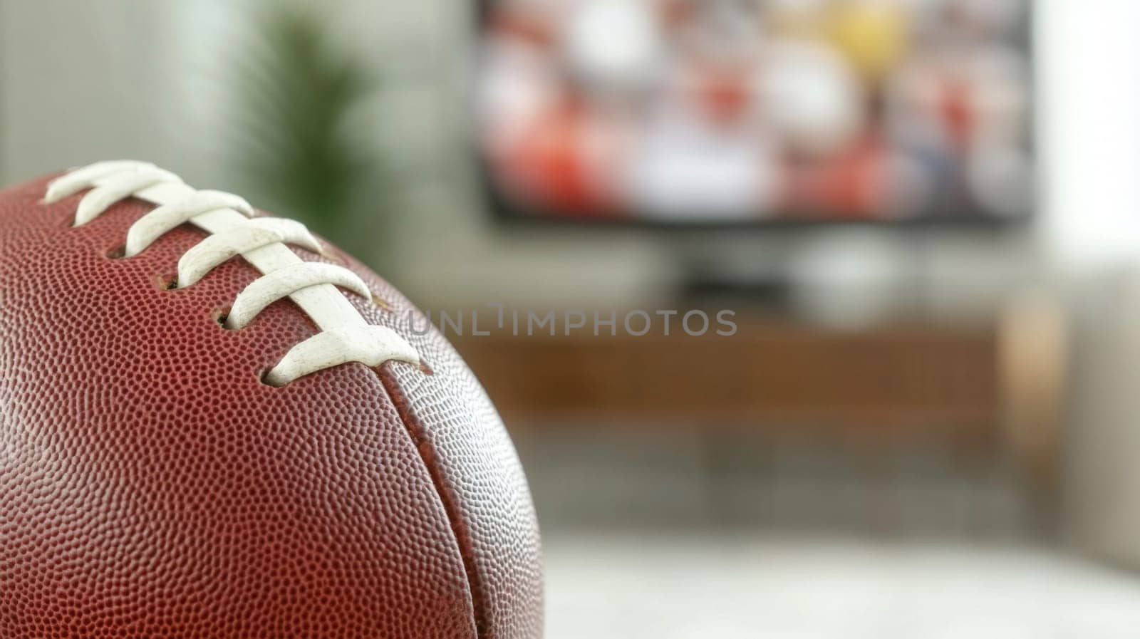 American football ball on foreground with blurred sport match on television in background, AI Generated