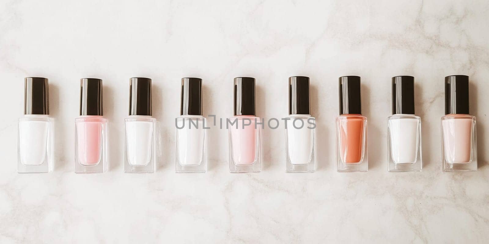 Nail polish bottles of neutral colors arranged on a marble background, AI Generated