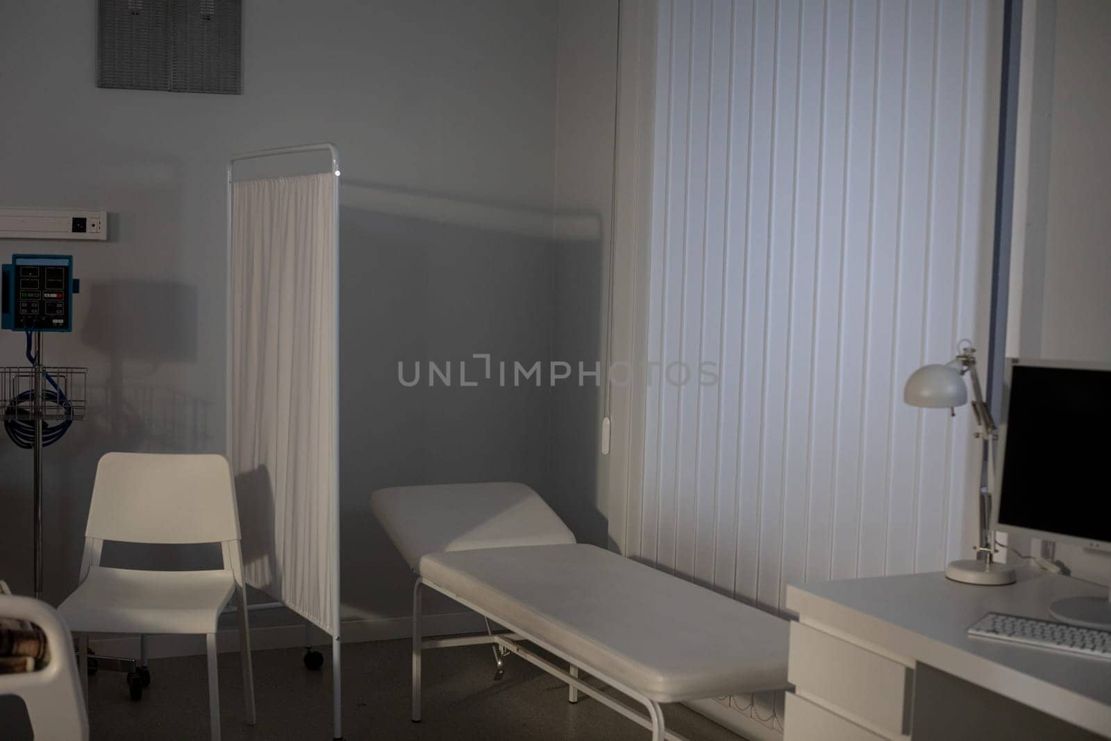 The medical examination room exudes serenity with its minimalistic design and soothing, calming colors
