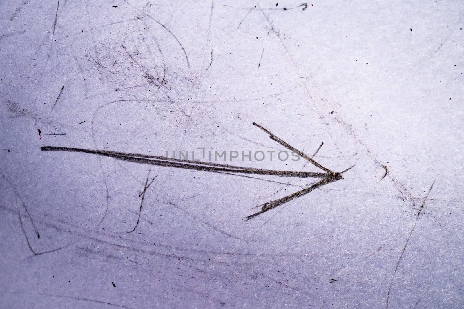 Grunge gritty doodle scratches, old paper. Vintage paper texture with dust scribble arrow. High quality photo