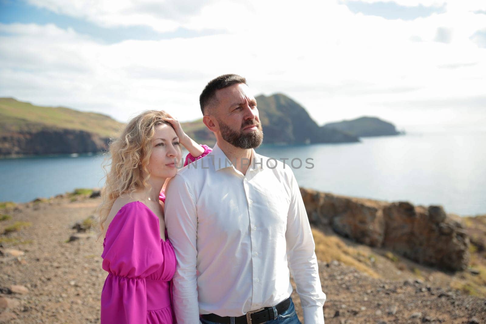 Couple admiring stunning ocean view from ponta de s o louren o, madeira