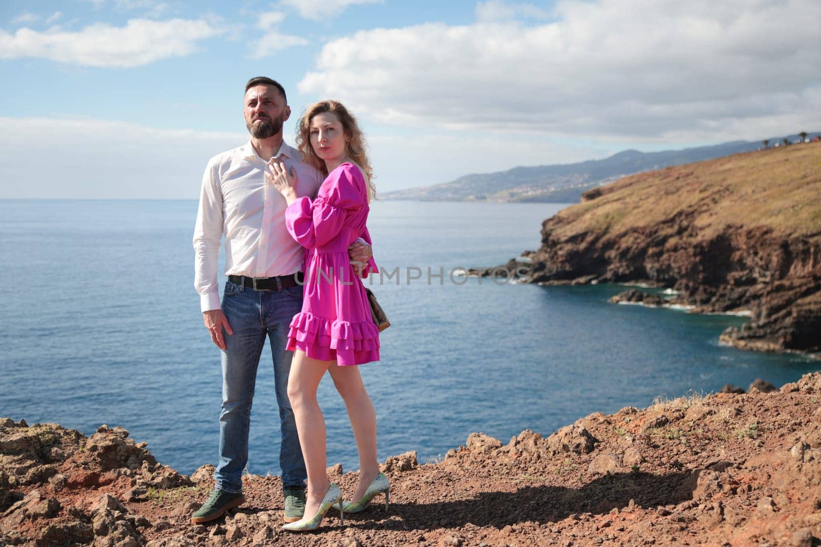 Couple enjoying breathtaking ocean view from ponta de s o louren o in madeira