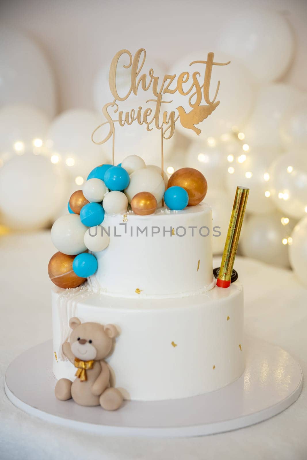 This wonderful twotier cake boasts vibrant decorations along with an adorable teddy bear, perfect for any celebrations