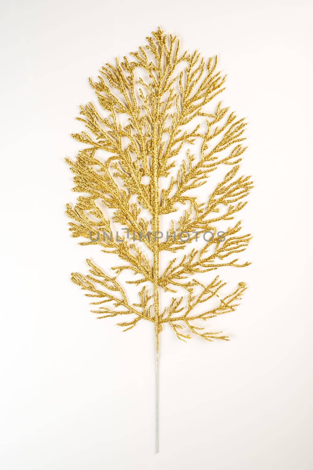 Fake shiny tree branch for decorating of bouquets and home in Christmas.