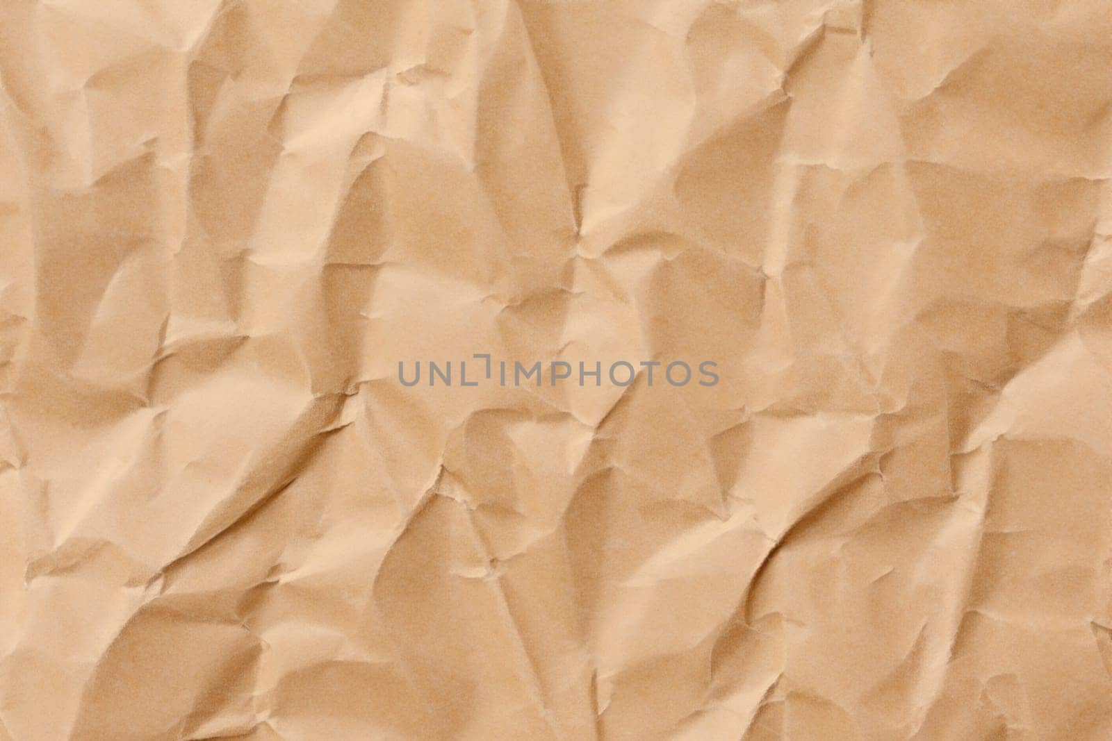 Brown crumpled paper texture. Abstract brown recycled paper background