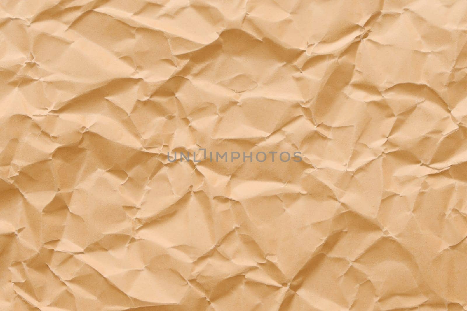 Brown crumpled paper texture. Abstract brown recycled paper background