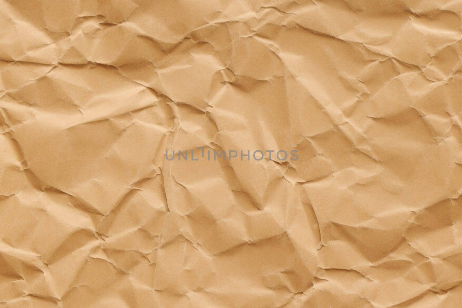 Brown crumpled paper texture. Abstract brown recycled paper background