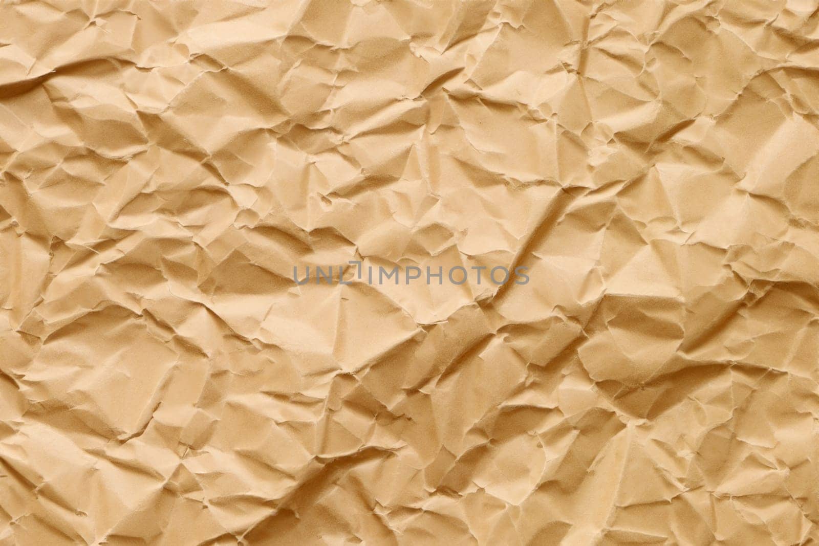 Brown crumpled paper texture. Abstract brown recycled paper background